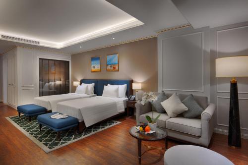 Кровать или кровати в номере FLC Halong Bay Golf Club & Luxury Resort
