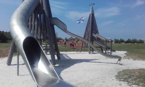 a playground with a slide in a park at Estrela de Aver o Mar in Póvoa de Varzim
