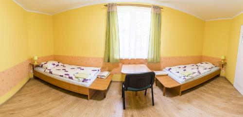 Ένα ή περισσότερα κρεβάτια σε δωμάτιο στο Szałas Muflon - Mufflonhütte