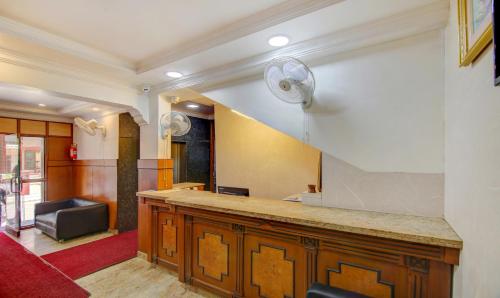 a kitchen with a counter top in a room at Itsy Hotels KES Residency, 10 Min From KSR Bengaluru City Junction in Bengaluru
