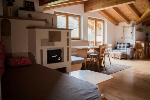 a living room with a couch and a fire place at Apartment Doll in Niederau