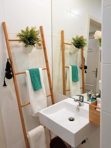 a bathroom with a sink and a mirror at Braga Bells Guesthouse in Braga