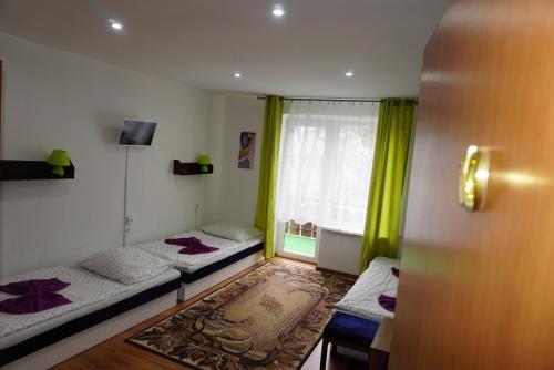 מיטה או מיטות בחדר ב-Hotel Guľa