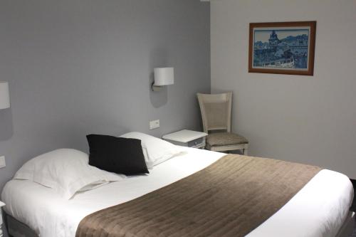 Postel nebo postele na pokoji v ubytování Appartement Vue Mer Au Jardin De La Comtesse