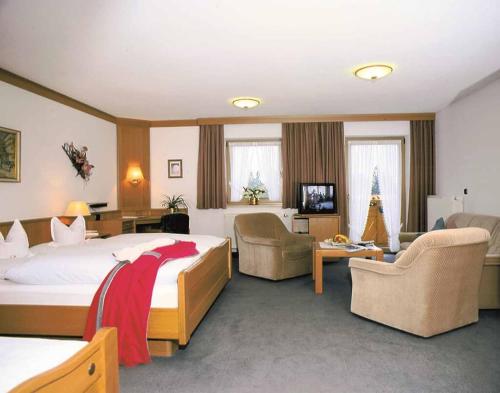 Postel nebo postele na pokoji v ubytování Hotel Märchenwald