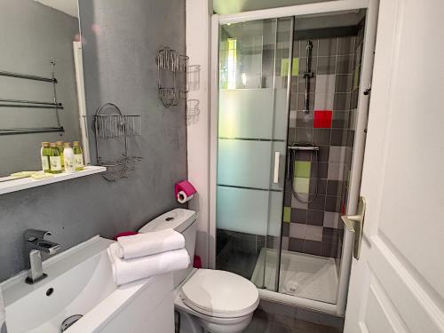 a bathroom with a shower and a toilet and a sink at Nestor&Jeeves - RED TOUCH - Central - Close sea in Nice