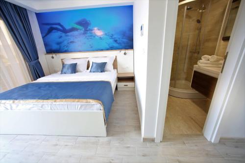 Giường trong phòng chung tại Vila La ViTa del Mare