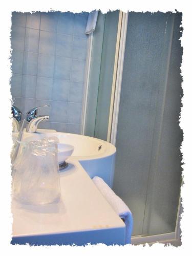 a bathroom with a sink and a shower at Hotel Green castellani in Vicenza
