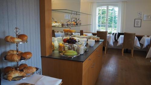 a kitchen filled with lots of different types of food at Villa Neugarten in Hagnau