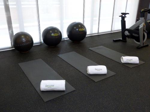 a gym with pilates balls and towels on the floor at Sercotel Madrid Aeropuerto in Madrid