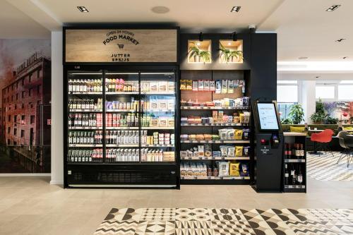 a store with a large amount of products on display at Leonardo Hotel Rotterdam Savoy in Rotterdam