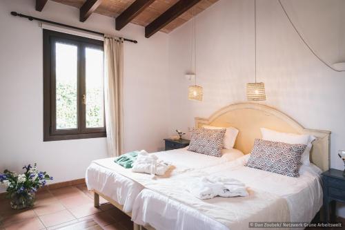 Giường trong phòng chung tại Sa Vaqueria