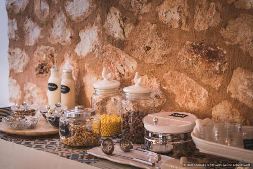 a table with jars of food on a counter at Sa Vaqueria in Porto Cristo