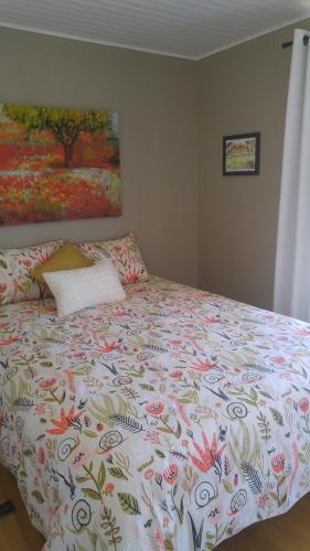 מיטה או מיטות בחדר ב-La Maison du Village