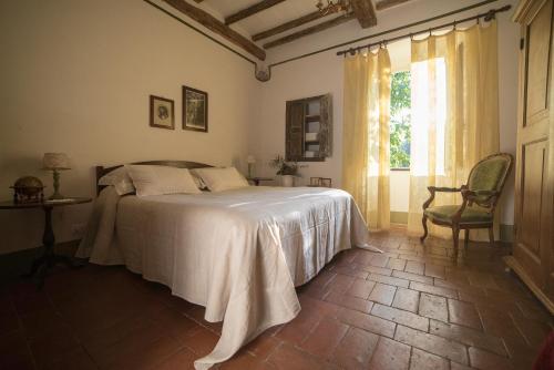 Casale Amati Country House tesisinde bir odada yatak veya yataklar