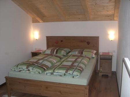 Un pat sau paturi într-o cameră la Haus Milli