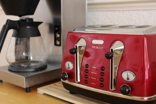 a red toaster sitting on top of a counter at The Ashley in Morecambe