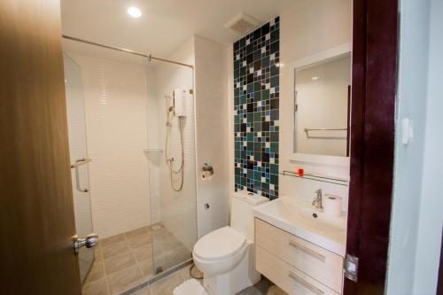 a bathroom with a toilet and a sink and a shower at Aonang Ocean View Studio ( The Sea Condo ) in Ao Nang Beach