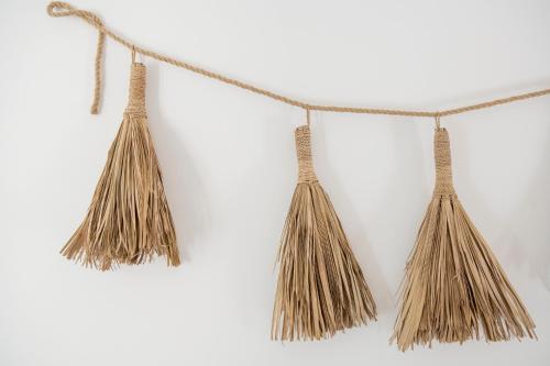 a bunch of tassels hanging on a rope at Curolla Petit Hotel in Maria de la Salut
