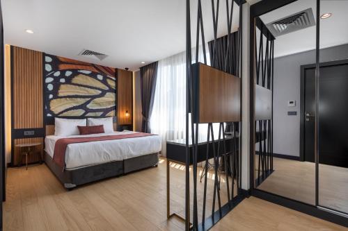 A bed or beds in a room at Nox Suite