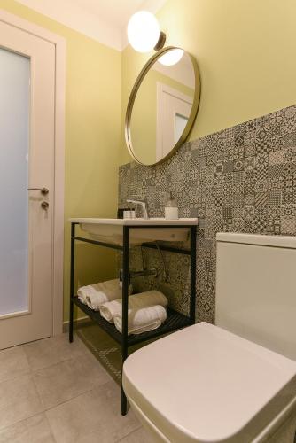 a bathroom with a sink and a mirror at ATHENS STORIES in Athens