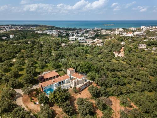 an aerial view of a house with the ocean at Vilia, House on the Hill in Chania Town