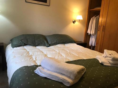 Una cama o camas en una habitación de Las Golondrinas