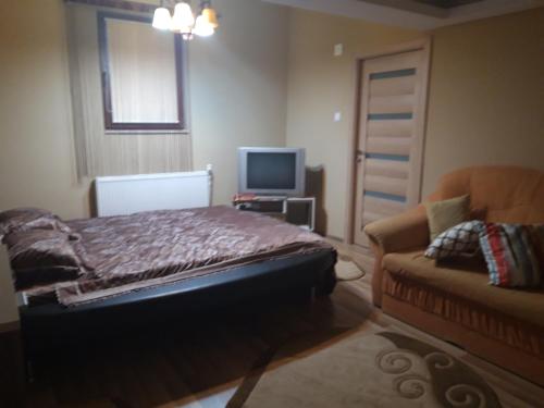Giường trong phòng chung tại Colț de rai - camera de inchiriat