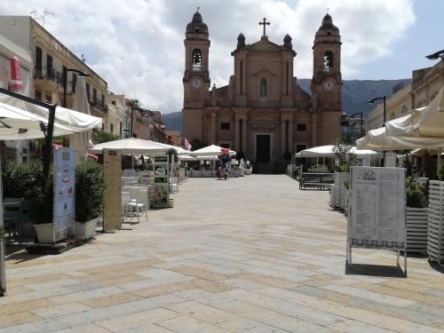 an empty street in front of a church at Terra Sinus Holiday House in Terrasini