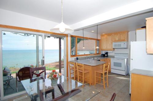 a kitchen with a view of the ocean at Cozy Lake Michigan Cottage on Lake Michigan-Pet Friendly! in Sheboygan