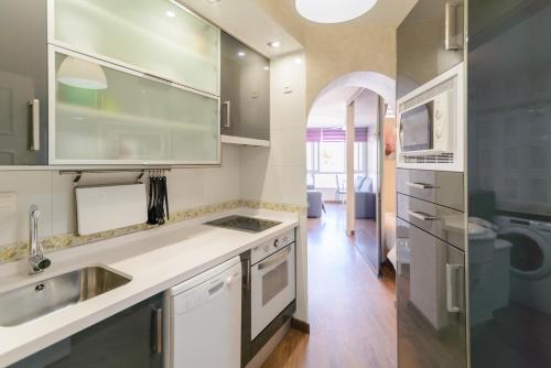 a kitchen with a sink and a counter top at Apartamento costa del oro in Torrox Costa