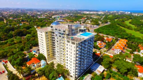 an overhead view of a tall white building at Nyali Golf View Residence in Mombasa