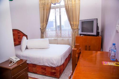TV a/nebo společenská místnost v ubytování Natron Palace Hotel