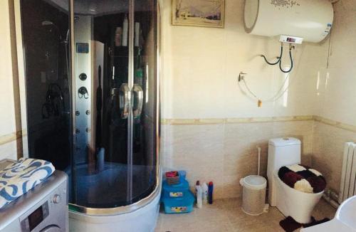 a bathroom with a shower in the corner of a room at Ger ,Bulbul Jamak travel in Ölgiy