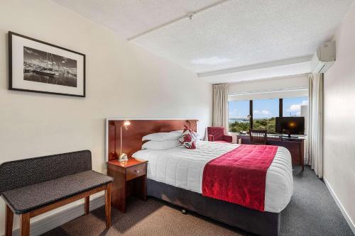 a hotel room with a bed and a window at The Parnell Hotel & Conference Centre in Auckland