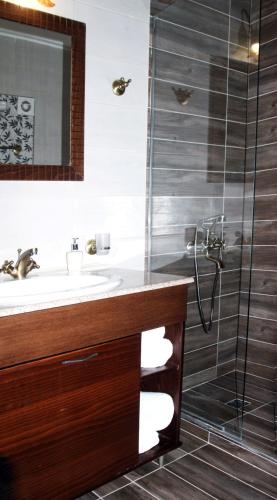 a bathroom with a sink and a shower at Paralia Beach Boutique Hotel in Paralia Katerinis