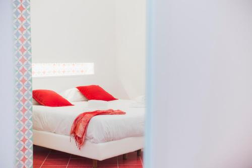 Postel nebo postele na pokoji v ubytování Hotel De Rosa