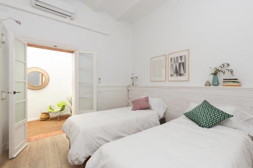 Postel nebo postele na pokoji v ubytování Casa Cosi - Eixample 1