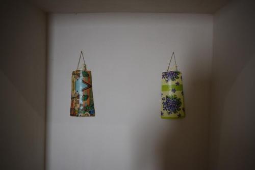 two towels are hanging on a wall at Dovì Casa Vacanze in Carovigno