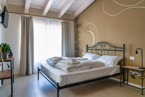 Postel nebo postele na pokoji v ubytování Casa Giardini