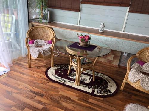 a room with a table and two chairs at Terrace apartment s 1 spálńou Sofia-parking & Wifi in Bratislava