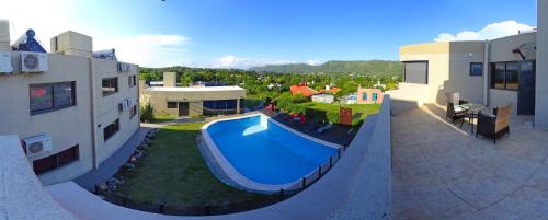 an aerial view of a house with a swimming pool at Complejo Namaste in San Antonio de Arredondo