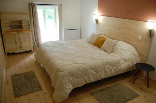 Кровать или кровати в номере Gite du chateau