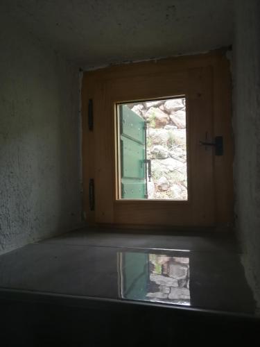 an empty room with a window and a window sill at House Kaja in Jablanac