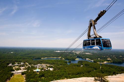a gondola ride in the sky over a lake at Atlanta Evergreen Lakeside Resort in Stone Mountain
