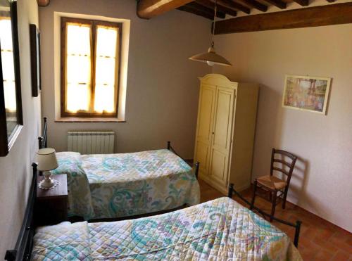 เตียงในห้องที่ Agriturismo Podere Valdilucciole