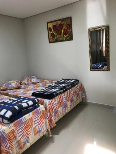 Säng eller sängar i ett rum på Pousada Santa Maria