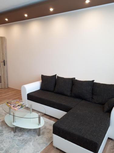 a living room with a couch and a coffee table at Apartment TT6 in Trnava