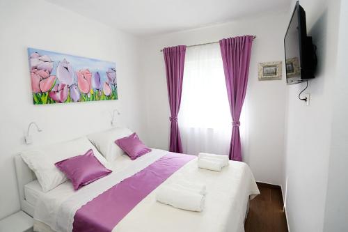 Posteľ alebo postele v izbe v ubytovaní Apartments Romarin