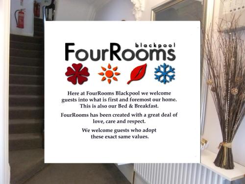 un cartel en la puerta de una tienda con flores en FourRooms - Couples Only, en Blackpool